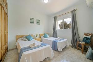 Łóżko lub łóżka w pokoju w obiekcie 3314 Villa Belinda