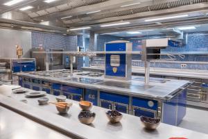 a large kitchen with bowls on a counter at Europe Villa Cortes GL in Playa de las Americas