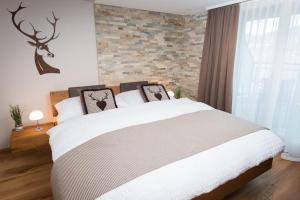 Posteľ alebo postele v izbe v ubytovaní Hotel Roggerli