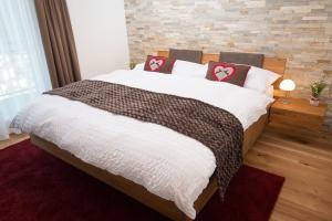 Posteľ alebo postele v izbe v ubytovaní Hotel Roggerli
