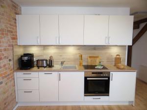 Köök või kööginurk majutusasutuses Speicher Residenz Barth E1 App 9