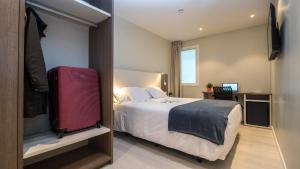 Postel nebo postele na pokoji v ubytování Hotel Ciudadela Pamplona