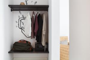 
a closet filled with lots of clothes and accessories at Eco Boutique Hostal Grau in Barcelona
