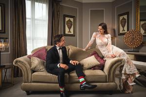 a man and a woman sitting on a couch at Midlands Park Hotel in Portlaoise