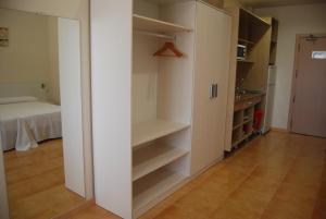 Cama o camas de una habitación en Apartamentos Turisticos Mediterraneo