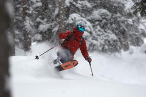 a person is skiing down a snow covered slope at Piltriquitron Lodging in Sankt Anton am Arlberg