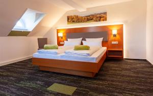 Postel nebo postele na pokoji v ubytování Hotel Meyer