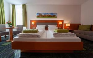 Postel nebo postele na pokoji v ubytování Hotel Meyer