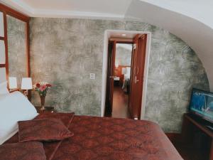 a hotel room with a bed and a hallway at Dareyn Hotel in Istanbul