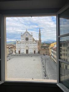 a view of a large building from a window at ATTICO IN PIAZZA SANTA CROCE in Florence