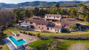 an aerial view of a house with a swimming pool at Masia Les Apieres in El Pla de Manlleu