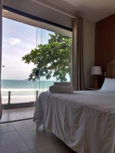 Cama ou camas em um quarto em Casatua Pousada