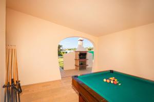 a pool table in a room with a lighthouse at Villa Ushuaia by Algarve Vacation in Guia