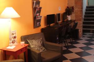 
a living room filled with furniture and a tv at Hostel New York in Barcelona
