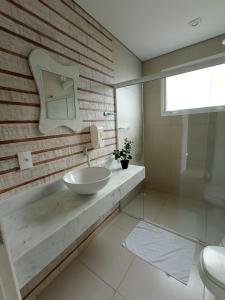 Um banheiro em Casatua Pousada
