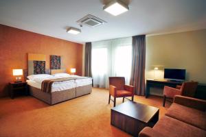 Ένα ή περισσότερα κρεβάτια σε δωμάτιο στο Hotel BELASSI