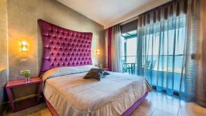 Rúm í herbergi á Tridente Mare Apart Hotel