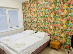 Postel nebo postele na pokoji v ubytování Apartmány LETO