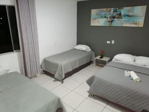Postel nebo postele na pokoji v ubytování Suite Trujillo