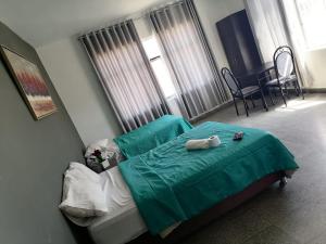 Postel nebo postele na pokoji v ubytování Suite Trujillo