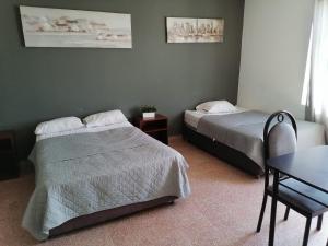 Postel nebo postele na pokoji v ubytování Suite Trujillo