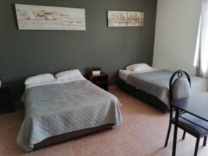 Postel nebo postele na pokoji v ubytování Suite Trujillo