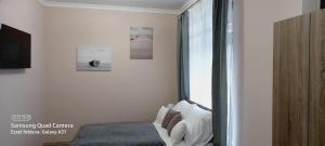 Posteľ alebo postele v izbe v ubytovaní Hajnalcsillag Apartman