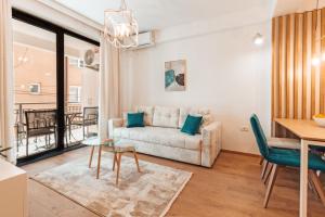 a living room with a couch and a table at Blue Lake Apartments in Ohrid