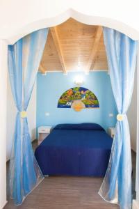 Postel nebo postele na pokoji v ubytování Blu Beach Studio