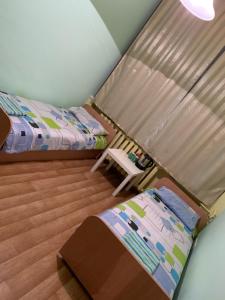 מיטה או מיטות בחדר ב-Nuomojami kambariai Kelmeje