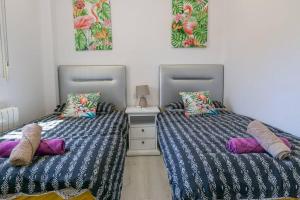 Posteľ alebo postele v izbe v ubytovaní Casa Lilly-Rose, a beautiful 3 bedroom detached villa a short walk to the Villamartin Plaza & Golf course