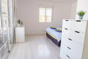 Posteľ alebo postele v izbe v ubytovaní Casa Lilly-Rose, a beautiful 3 bedroom detached villa a short walk to the Villamartin Plaza & Golf course