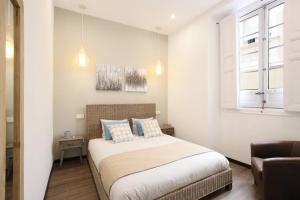 En eller flere senge i et værelse på Agradable apartamento en el Madrid de los Austrias
