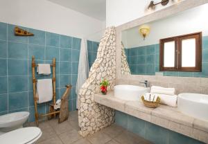 Koupelna v ubytování Mvuvi Boutique Resort