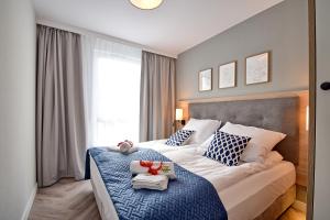 Katil atau katil-katil dalam bilik di Apartamenty Bel Mare SeaView by Rent like home