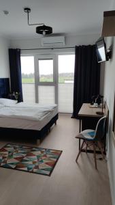 Posteľ alebo postele v izbe v ubytovaní Hotel ANTARES