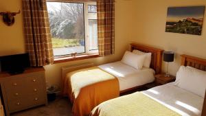 Кровать или кровати в номере Moorside Rooms
