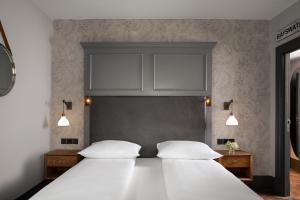 Un pat sau paturi într-o cameră la Hapimag Apartments London