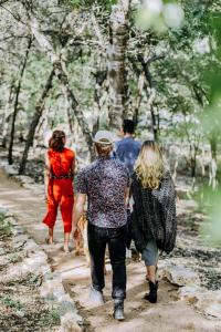 a group of people walking down a path at Wimberley Inn in Wimberley