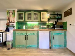 A kitchen or kitchenette at Bohemian weekendhouse at lake Balaton