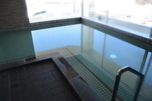 an empty swimming pool in a building at Shiretoko Noble Hotel in Shari