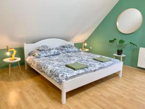 Postel nebo postele na pokoji v ubytování Vazul Vendégház