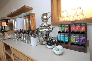 a counter with bottles of wine on it at Alpinhotel Berchtesgaden in Berchtesgaden