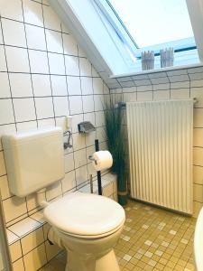 Koupelna v ubytování Orchidee + 20 fotografií