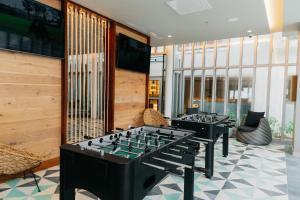 a row of tables in a room with chairs at Emporio Cancun - Buy All Inclusive Option in Cancún