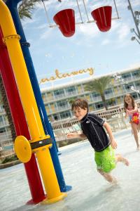 a boy and a girl playing on a playground at Universal's Cabana Bay Beach Resort in Orlando