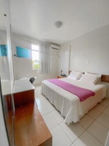Ένα ή περισσότερα κρεβάτια σε δωμάτιο στο Principe Hotel