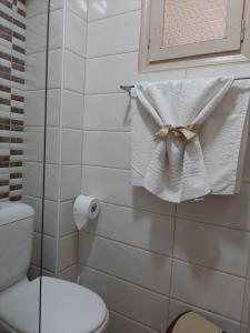 a bathroom with a towel with a bow on it at Mamas Reas in Káto Spílaion +39 photos