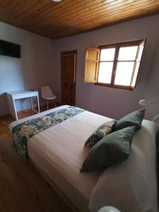 A bed or beds in a room at LA CAPILLA