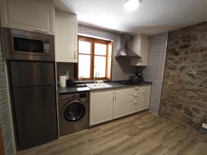 A kitchen or kitchenette at LA CAPILLA